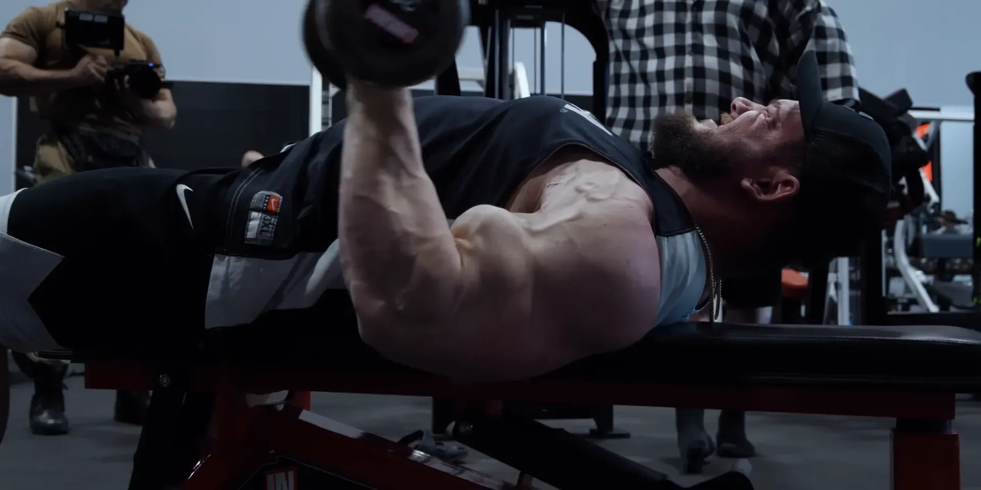 Showing the downward stretch in the lying dumbbell curl